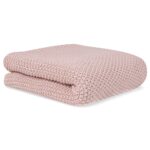 Manta de tricot rosa empolvado